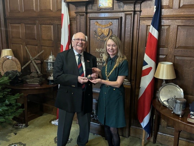 Mayor of Worcester, Mel Allcott, presenting Maurice Hume with the Nuclear Test Medal